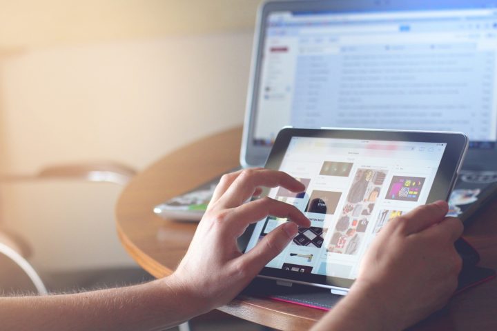 Woman browsing a website on her tablet